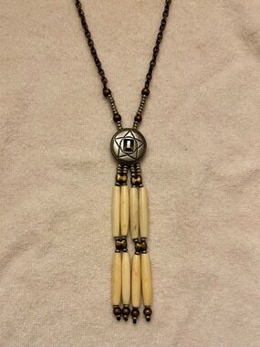 Vintage Native American-inspired necklace with metal medallion & hairpipe beads